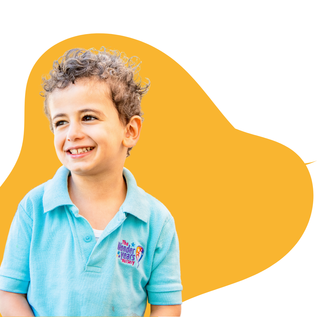 passionandcare Happy child smiling at The Wonder Years Nursery – A top-rated nursery near me in Dubai providing early childhood education through the British Early Years Foundation Curriculum