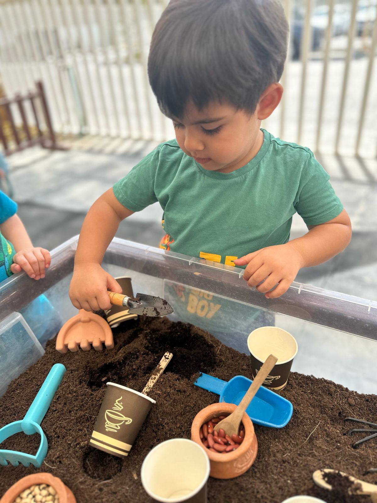 planting activity nursery Toddler planting seeds during Earth Day activities at The Wonder Years Nursery Remraam.