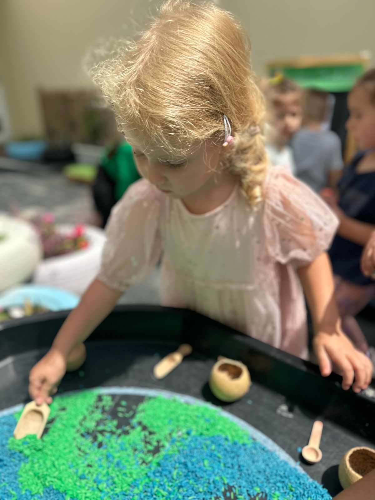 soil activity nursery dubai Child exploring soil and natural textures during Earth Day at our Remraam nursery in Dubai.