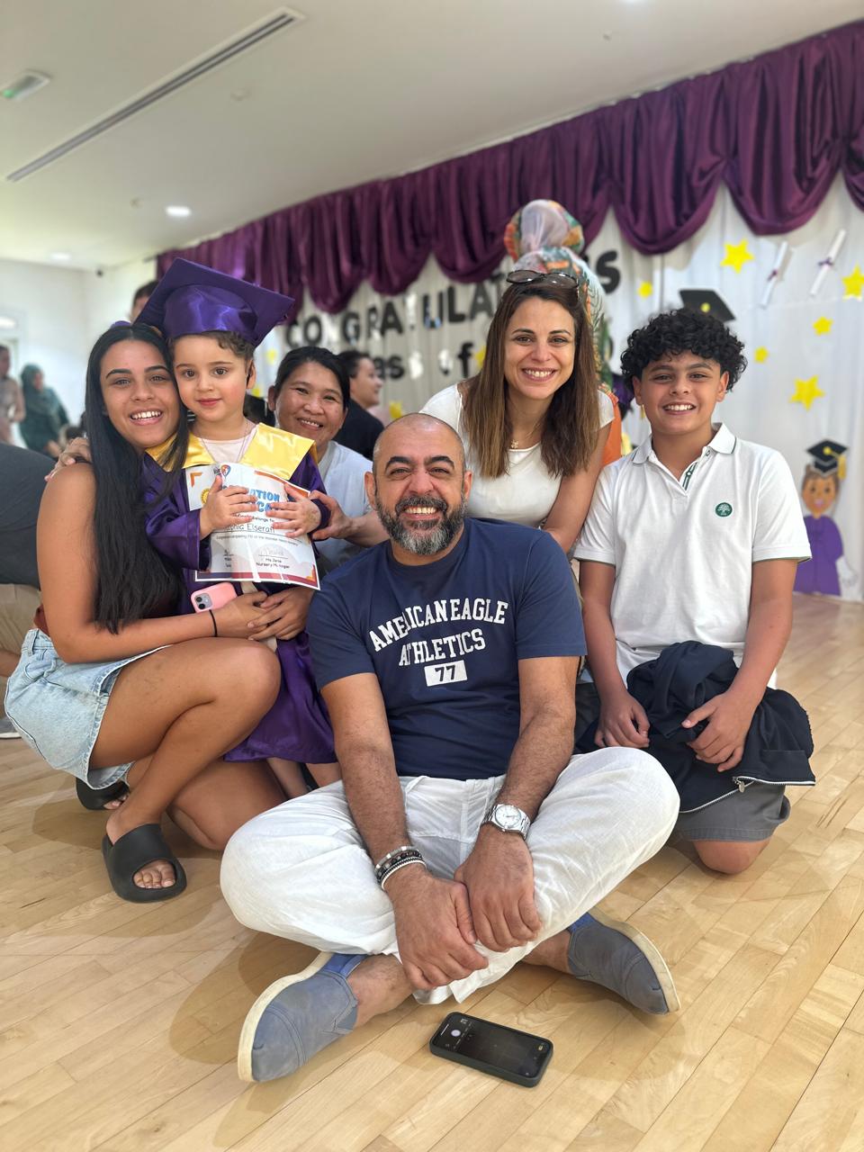 top-nurseries-in-dubai-fs1-graduation-family-photo.jpg S1 child celebrating with family at one of the top nurseries in Dubai