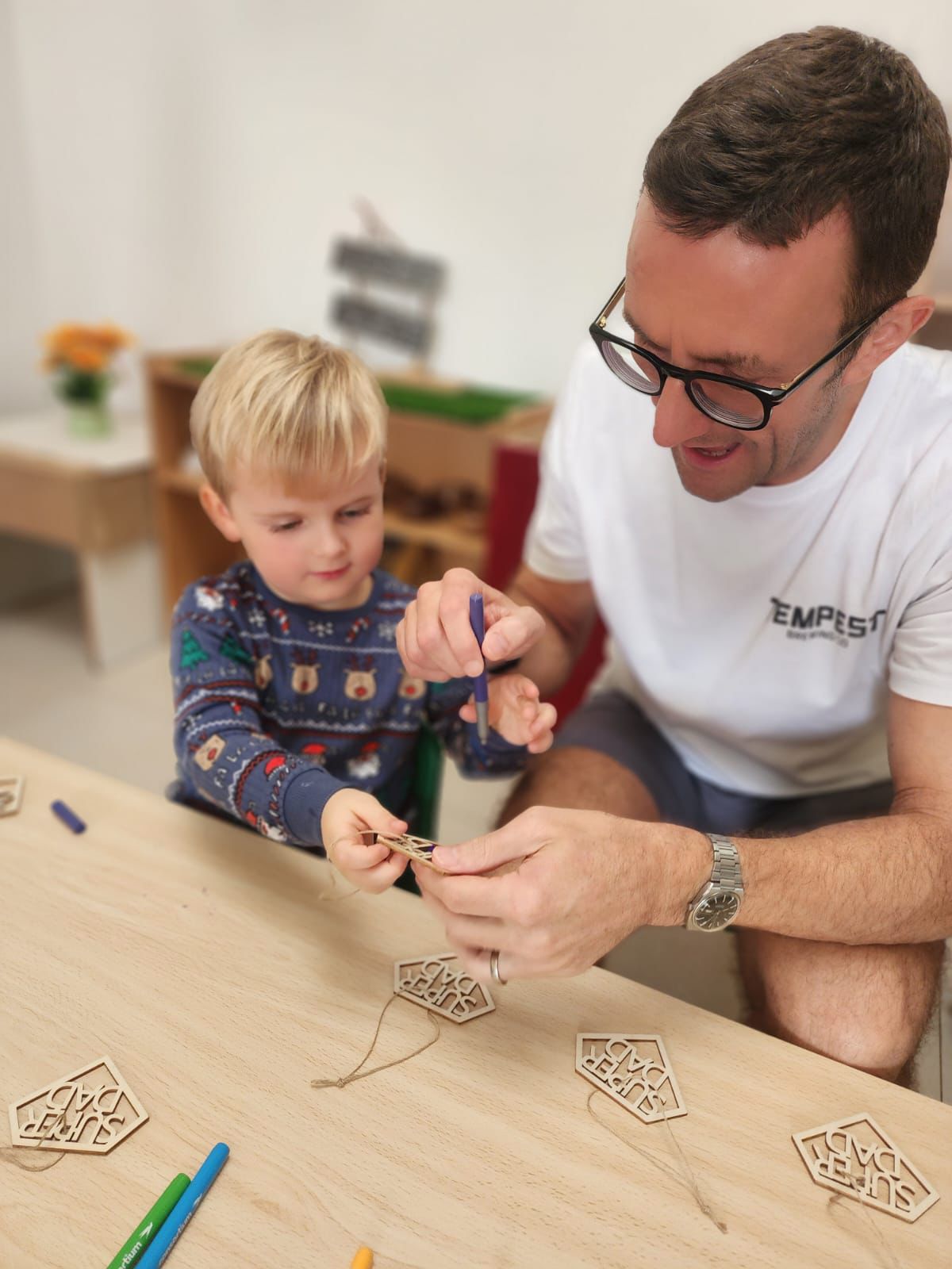 eyfs schools in dubai EYFS learning activity with father and child at a British nursery school in Dubai