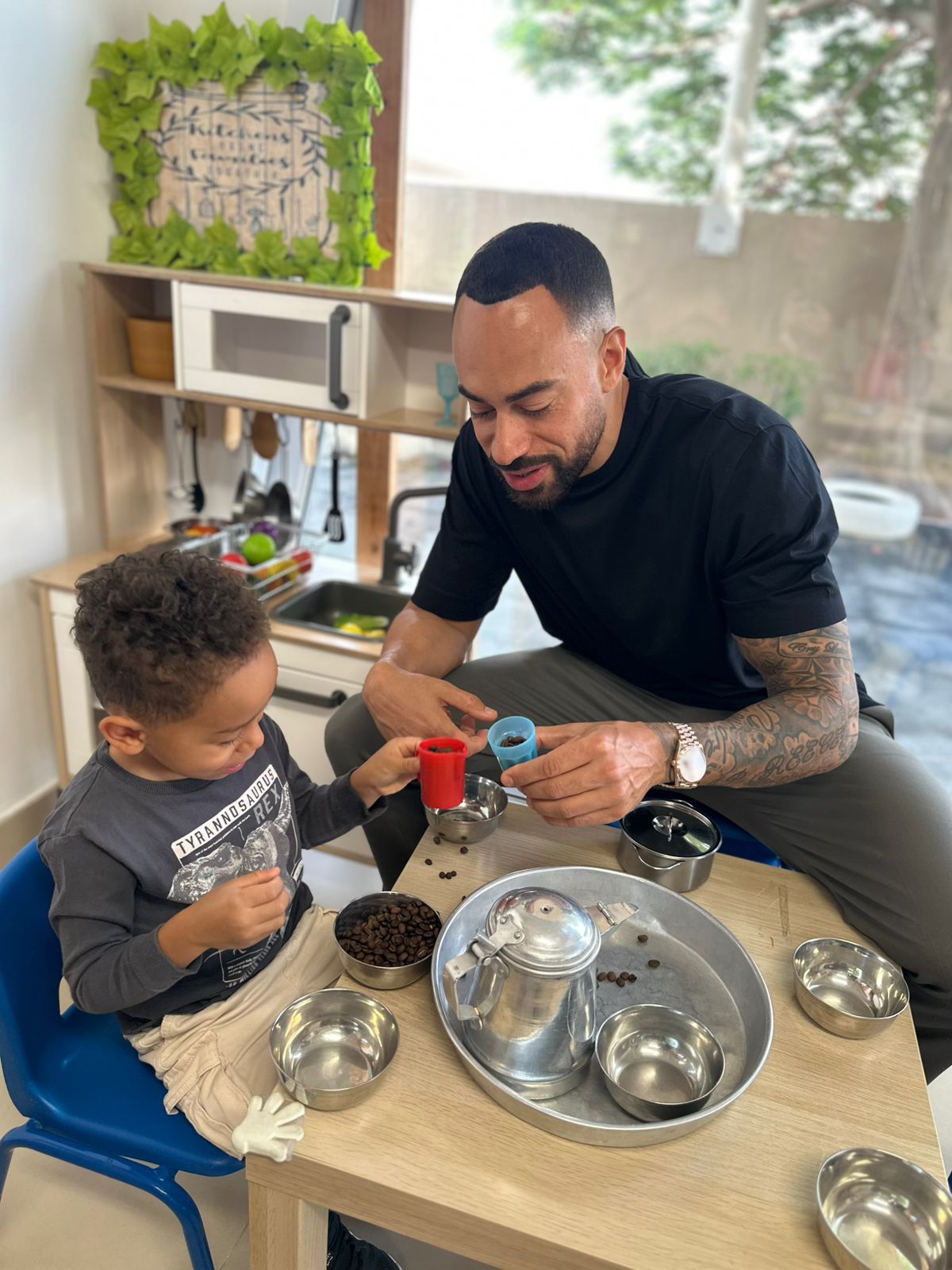 fathers day event at the wonder years nursery dubai Father and son exploring sensory play during Father’s Day at The Wonder Years Nursery Dubai