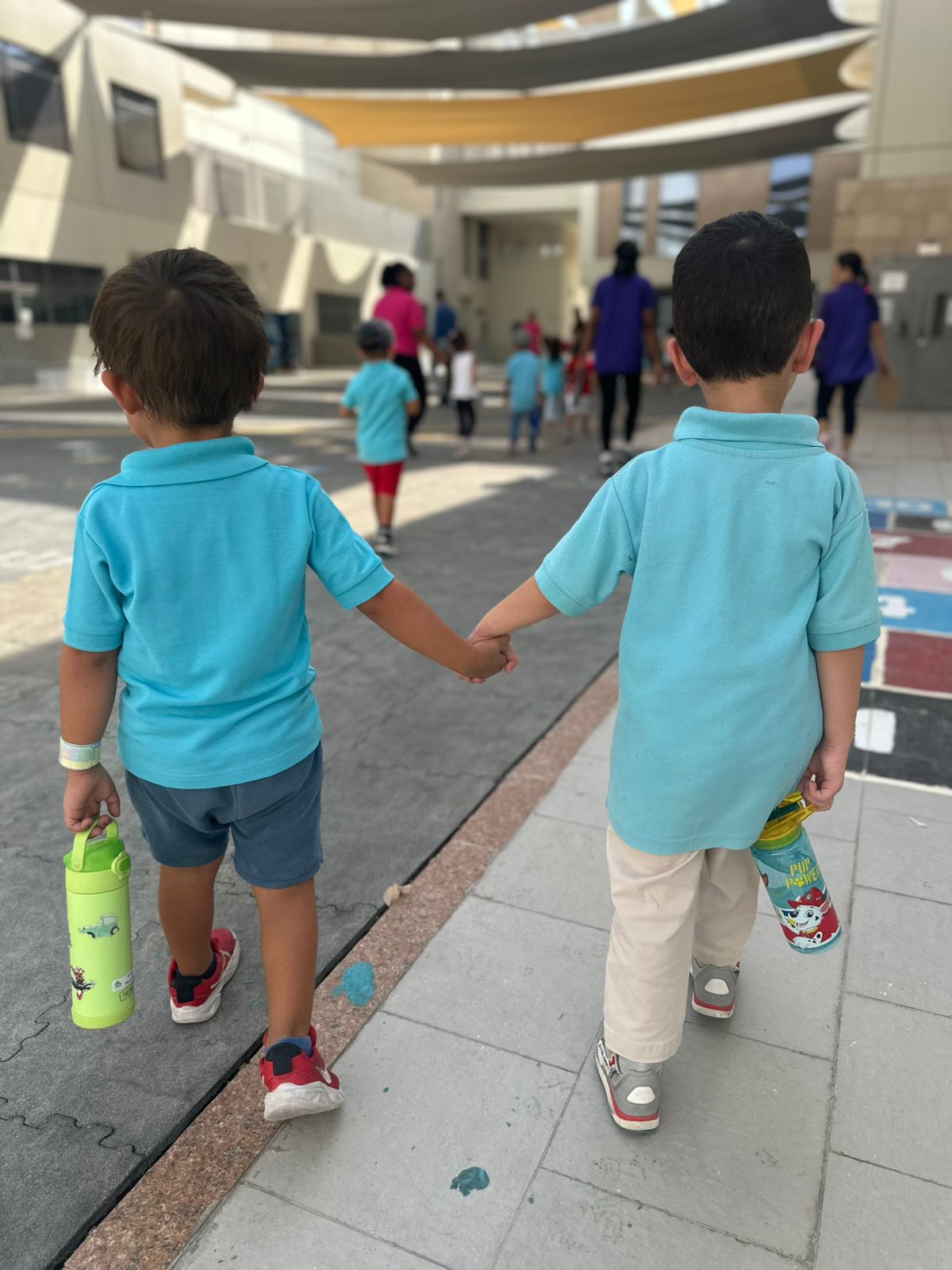 img-6 The Wonder Years Nursery students walking happily for their transition day event.